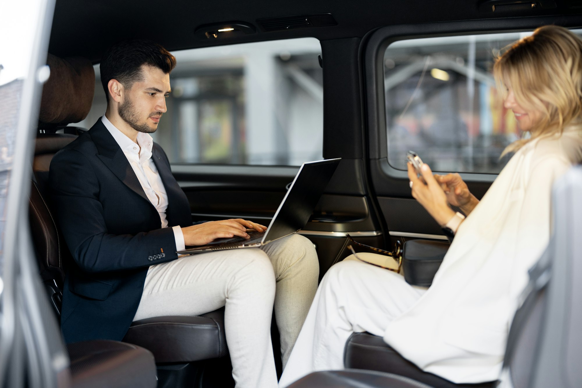 Business people sitting in minivan taxi