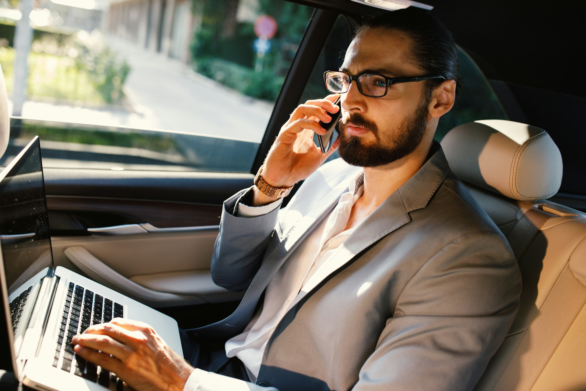 Businessman taking an executive class CEC minicabs taxi